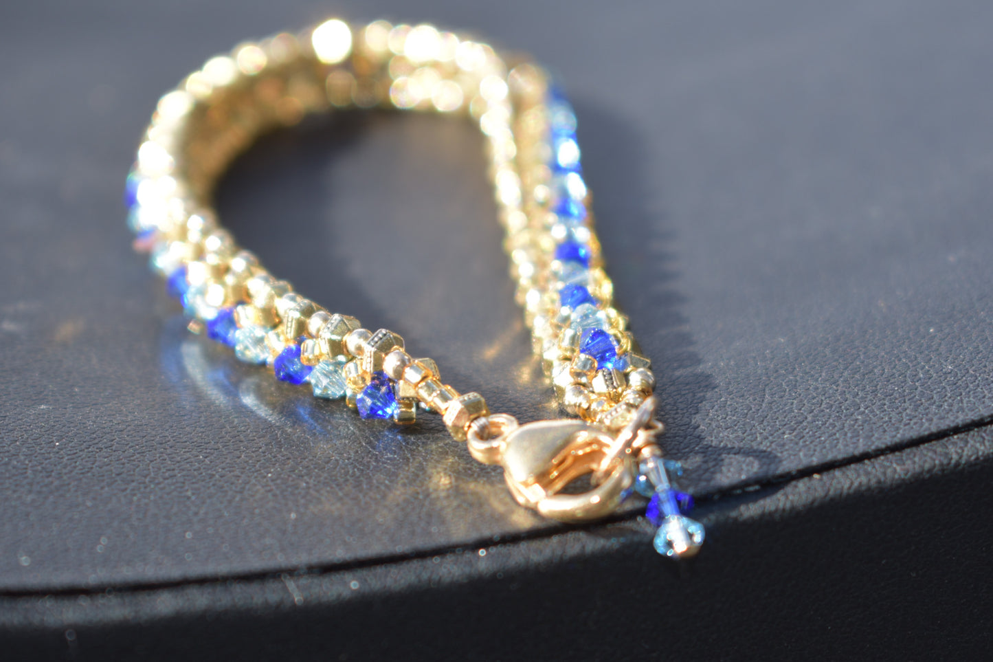 Gold and blue tennis bracelet