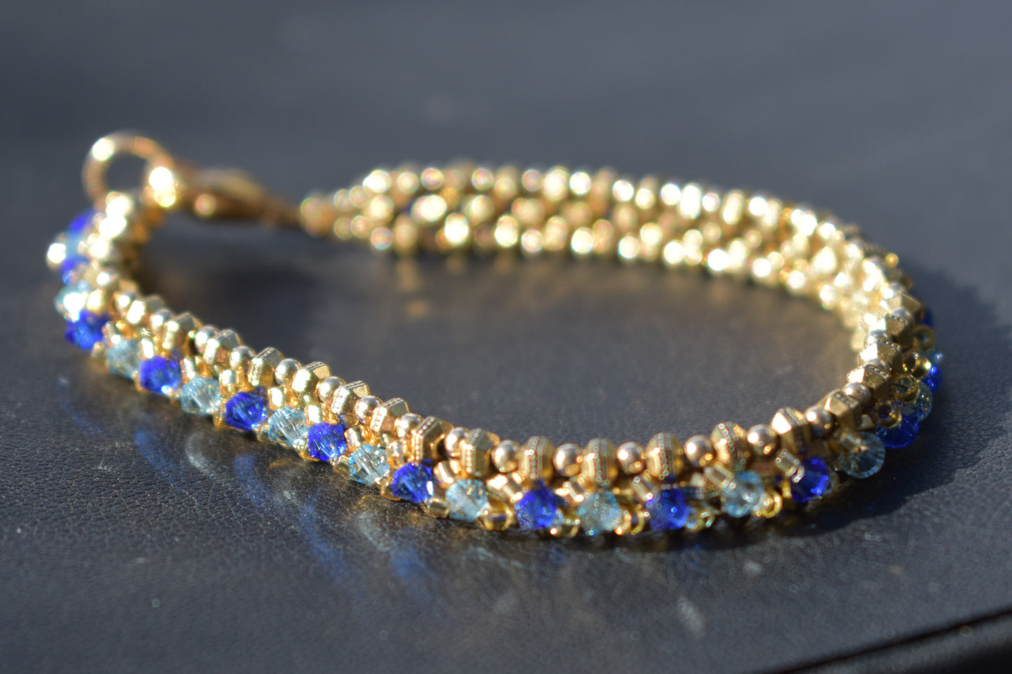 Gold and blue tennis bracelet