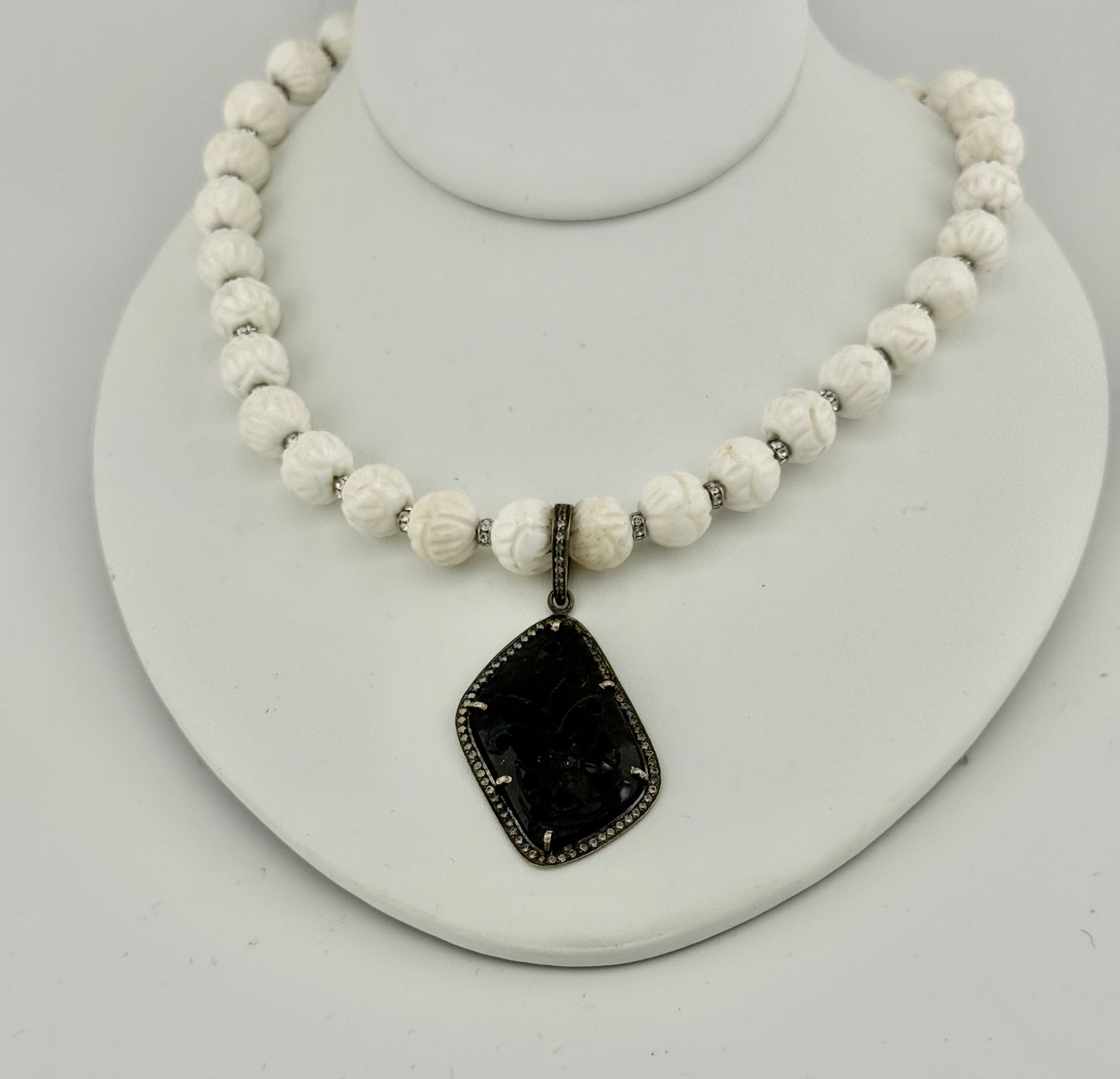 Carved Tridacna Shell and Swarovski Crystal Necklace with Carved Sapphire Pendant