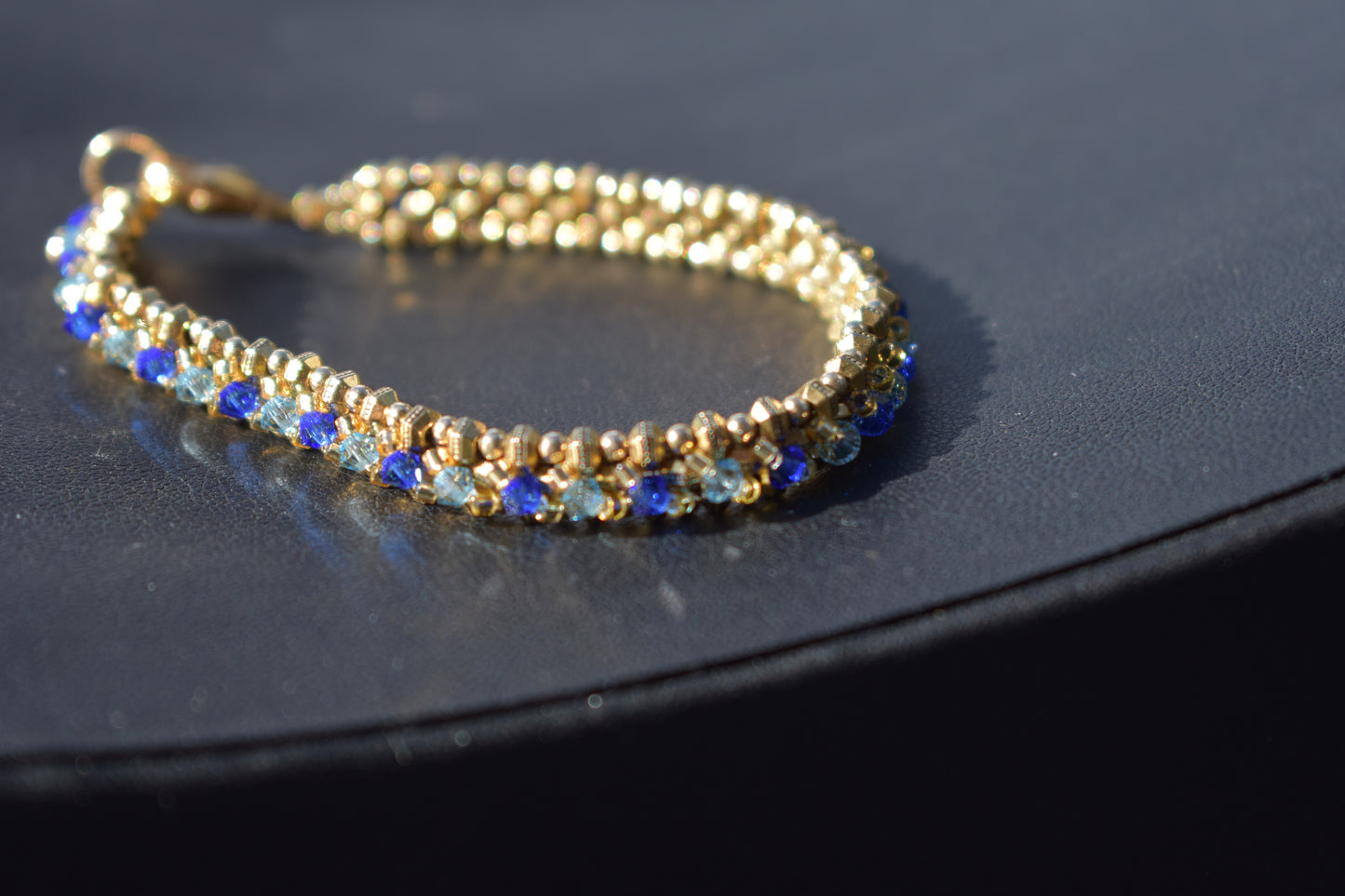 Gold and blue tennis bracelet