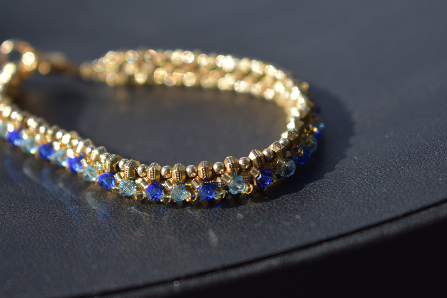 Gold and blue tennis bracelet